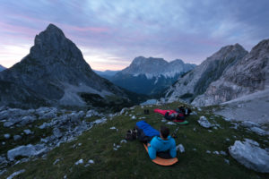Hiker overlooking the Seebensee with Zugspitze and Sonnenspitze,Wetterstein Mountains,Alps,Tyrol,Austria,Europe