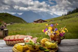 Quaint mountain pasture in the Alps, snack on the terrace, Berchtesgadener Land, Bavaria, Germany Quaint mountain pasture in the Alps, snack on the terrace, Berchtesgadener Land, Bavaria, Germany