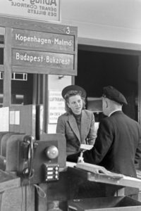 A female passenger with a customs officer at Berlin Tempelhof airport, Germany 1930s. A female passenger with a customs officer at Berlin Tempelhof airport, Germany 1930s.