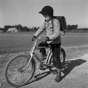 A school boy on his bicycle, Germany 1950s. A school boy on his bicycle, Germany 1950s.