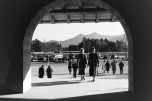 Young women taking a stroll in front of the panoramic view of the Chiemgau Alps, Germany 1930s. Young women taking a stroll in front of the panoramic view of the Chiemgau Alps, Germany 1930s.