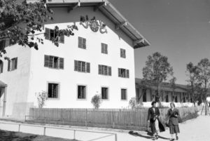 Two young women are strolling through the city hall area at the Chiemsee, Germany 1930s. Two young women are strolling through the city hall area at the Chiemsee, Germany 1930s.