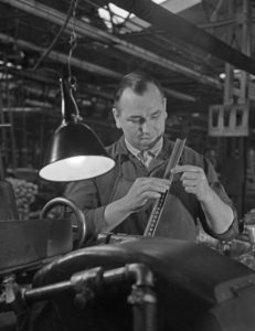 Worker at a factory hall at Mercedes Benz in Stuttgart, Germany 1930s. Worker at a factory hall at Mercedes Benz in Stuttgart, Germany 1930s.