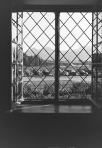 View out of a window on a parking space in front o the panoramic view of the Chiemgau alps, Germany 1930s. View out of a window on a parking space in front o the panoramic view of the Chiemgau alps, Germany 1930s.