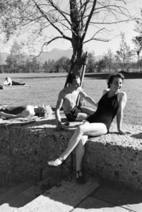 Two young women and a young man sunbathing and swimming in the Chiemsee, Dermany 1930s. Two young women and a young man sunbathing and swimming in the Chiemsee, Dermany 1930s.