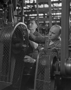 Worker at a factory hall at Mercedes Benz in Stuttgart, Germany 1930s. Worker at a factory hall at Mercedes Benz in Stuttgart, Germany 1930s.