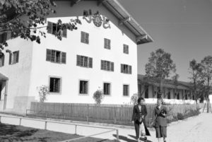 Two young women are strolling through the city hall area at the Chiemsee, Germany 1930s. Two young women are strolling through the city hall area at the Chiemsee, Germany 1930s.