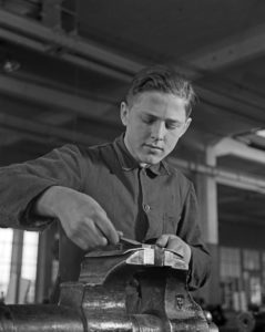 Worker at a factory hall at Mercedes Benz in Stuttgart, Germany 1930s. Worker at a factory hall at Mercedes Benz in Stuttgart, Germany 1930s.