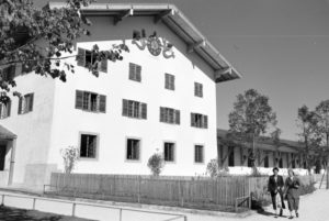 Two young women are strolling through the city hall area at the Chiemsee, Germany 1930s. Two young women are strolling through the city hall area at the Chiemsee, Germany 1930s.