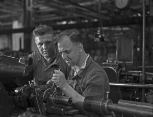 Worker at a factory hall at Mercedes Benz in Stuttgart, Germany 1930s. Worker at a factory hall at Mercedes Benz in Stuttgart, Germany 1930s.