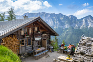 Germany, Bavaria, Berchtesgadener Land, Ramsau, guests on the terrace of the Schärtenalm in the Hochkalter Mountains with a view to the Reiteralpe Germany, Bavaria, Berchtesgadener Land, Ramsau, guests on the terrace of the Schärtenalm in the Hochkalter Mountains with a view to the Reiteralpe