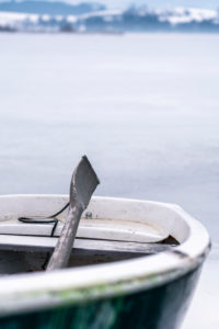Rowboat, Winter at Hopfensee, Allgäu Alps, Bavaria, Germany Rowboat, Winter at Hopfensee, Allgäu Alps, Bavaria, Germany