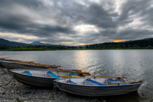 Rowing boats on Grüntensee, Oberallgäu, Bavaria, Germany Rowing boats on Grüntensee, Oberallgäu, Bavaria, Germany