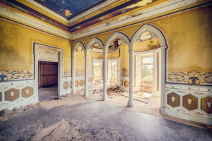 Ballroom in an abandoned castle with columns and blue ceiling Ballroom in an abandoned castle with columns and blue ceiling