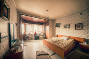 The bedroom in a deserted residential house, abandoned for decay The bedroom in a deserted residential house, abandoned for decay