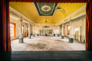 A former ballroom with chandelier and stage A former ballroom with chandelier and stage