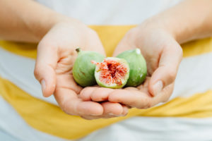 Figs in the hands of a young woman Figs in the hands of a young woman