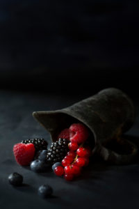 Berries and old zinc can Berries and old zinc can