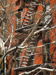 Fire exit stairs on typical New York brick buildings in Manhattan, New York City, USA Fire exit stairs on typical New York brick buildings in Manhattan, New York City, USA