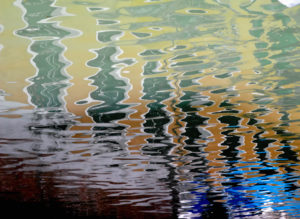 Water reflection in a canal in Venice, Italy Water reflection in a canal in Venice, Italy
