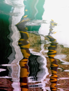 Water reflection in a canal in Venice, Italy Water reflection in a canal in Venice, Italy