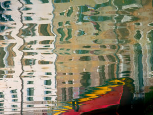 Water reflection in a canal in Venice, Italy Water reflection in a canal in Venice, Italy