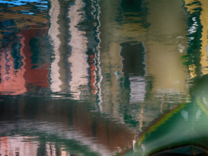 Water reflection in a canal in Venice, Italy Water reflection in a canal in Venice, Italy