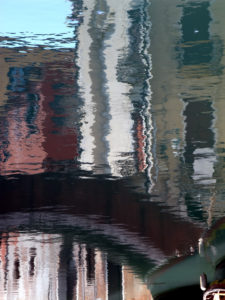 Water reflection in a canal in Venice, Italy Water reflection in a canal in Venice, Italy