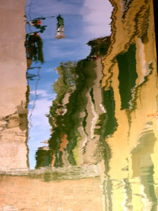 Water reflection in a canal in Venice, Italy Water reflection in a canal in Venice, Italy