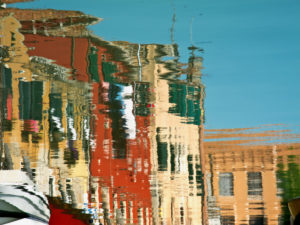 Water reflection in a canal in Venice, Italy Water reflection in a canal in Venice, Italy
