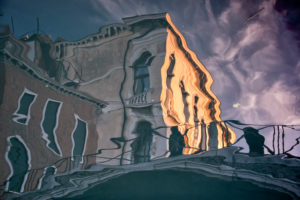 Water reflection in a canal in Venice, Italy Water reflection in a canal in Venice, Italy