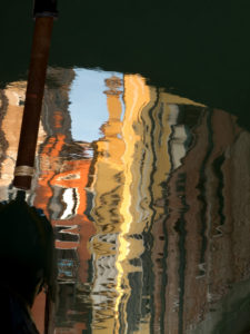 Water reflection in a canal in Venice, Italy Water reflection in a canal in Venice, Italy