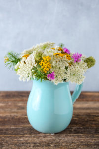 Summer bouquet of meadow flowers on a wooden table Summer bouquet of meadow flowers on a wooden table