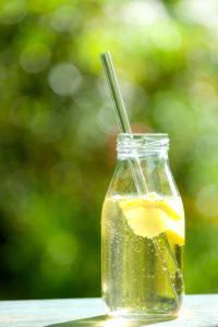 Homemade lemonade on a wooden table in the garden Homemade lemonade on a wooden table in the garden