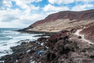 Coast and volcanic landscape at Montana Roja on Tenerife in slightly cloudy sky Coast and volcanic landscape at Montana Roja on Tenerife in slightly cloudy sky
