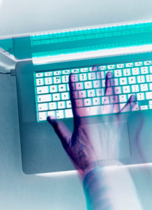 Cyber crime, hacker attacking a computer laptop with a virus Cyber crime, hacker attacking a computer laptop with a virus