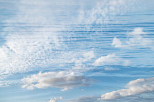 Double exposure water and sky with clouds Double exposure water and sky with clouds