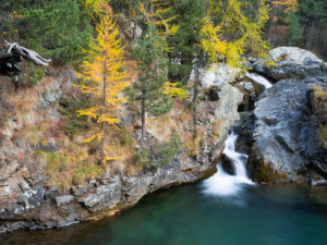 Autumnal waterfall in the Morteratsch valley, Canton of Grisons, Switzerland Autumnal waterfall in the Morteratsch valley, Canton of Grisons, Switzerland