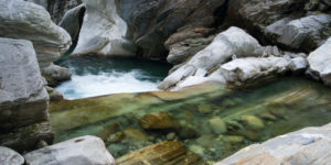 Wild river between rock stones in the Verzascatal, Ticino, Switzerland Wild river between rock stones in the Verzascatal, Ticino, Switzerland