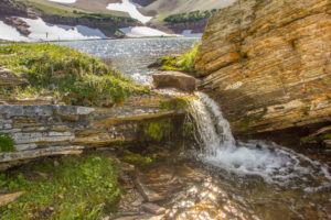 Mountain lake with brook, Rocky Mountains, Canada Mountain lake with brook, Rocky Mountains, Canada