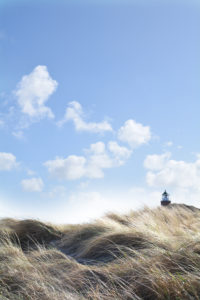 Lighthouse in the dunes on the island of Sylt, Kampen, Germany Lighthouse in the dunes on the island of Sylt, Kampen, Germany