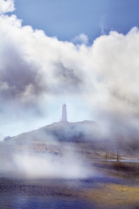 Lighthouse in fog and purpur clouds, Iceland Lighthouse in fog and purpur clouds, Iceland