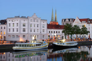 City Trave with old town and towers of the cathedral in the evening light, Lübeck, UNESCO World Heritage, Schleswig-Holstein, Germany City Trave with old town and towers of the cathedral in the evening light, Lübeck, UNESCO World Heritage, Schleswig-Holstein, Germany