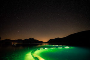 Surfer on Lake Walchensee at night, Bavaria, Germany Bavaria, Germany