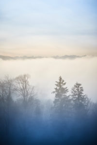 Over the clouds on the Sonntratn near Gaißach in Bavaria, chilly autumn mood, valley in the fog, mountains over the clouds