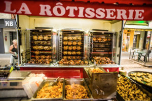In a Rotisserie grilled chickens are offered for sale, at the big market in Digne-les-Bains, Provence-Alpes-Côte d'Azur, France In a Rotisserie grilled chickens are offered for sale, at the big market in Digne-les-Bains, Provence-Alpes-Côte d'Azur, France