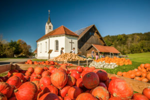Pumpkins for sale in front of a chapel, Isny, Baden-Wuerttemberg, Germany Pumpkins for sale in front of a chapel, Isny, Baden-Wuerttemberg, Germany