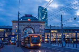 The central station vibrant with activity in the evening hours on the Willy Brandt square, Mannheim, Baden Wurttemberg, Germany The central station vibrant with activity in the evening hours on the Willy Brandt square, Mannheim, Baden Wurttemberg, Germany