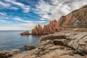 The landmark of Arbatax is a red prophyr rock with a big bay, Arbatax, Tortoli, Sardinia, Italy The landmark of Arbatax is a red prophyr rock with a big bay, Arbatax, Tortoli, Sardinia, Italy