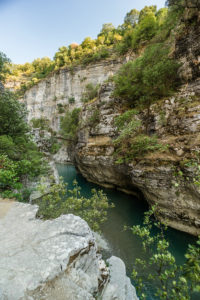 A wooden bridge leads at high altitude over the Osum Gorge, Çorovoda, Berat, Albania. A wooden bridge leads at high altitude over the Osum Gorge, Çorovoda, Berat, Albania.